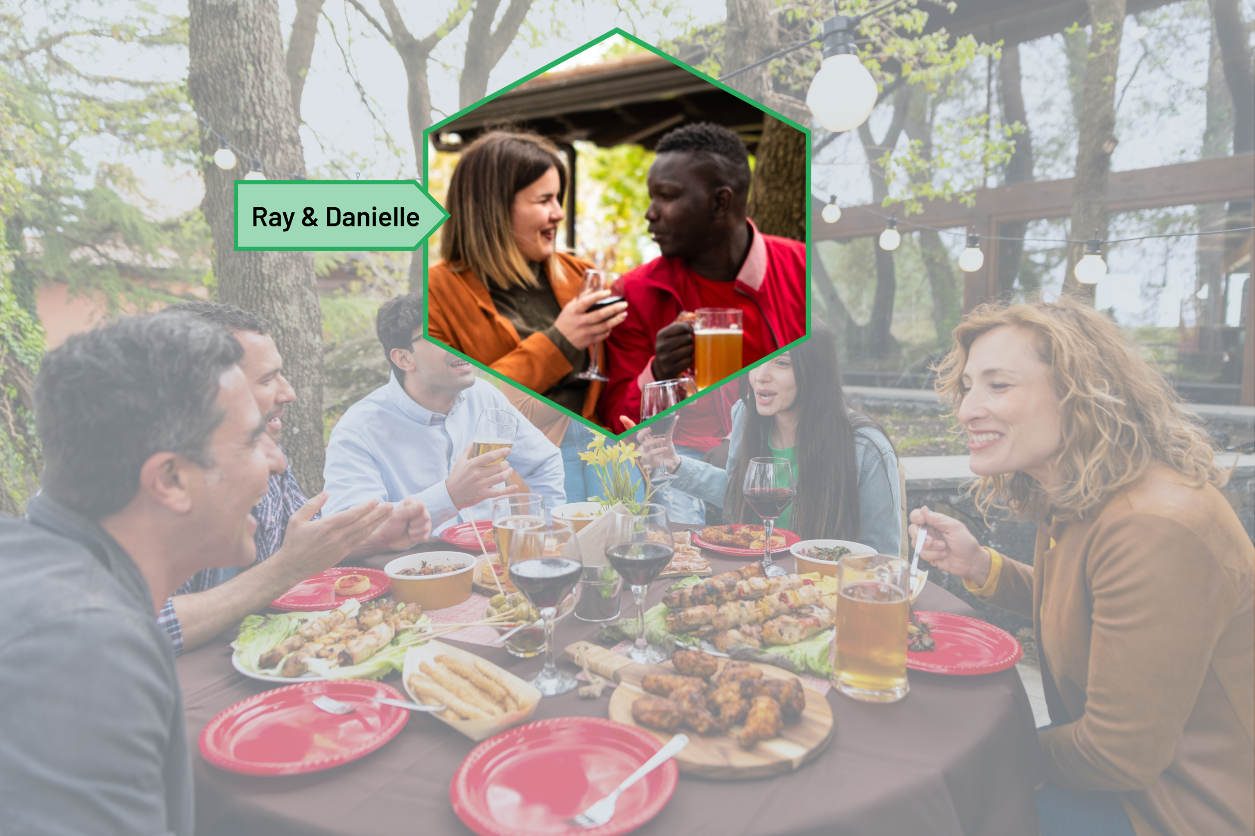 A group of adults laughing and dining together outdoors at a table decorated with string lights, plates of food, and drinks